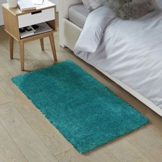 Photo ambiance chambre tapis shaggy descente de lit bleu Cocoon